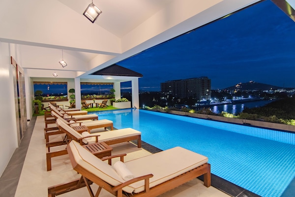 Outdoor pool, open 6:00 AM to 10:00 PM, free cabanas, sun loungers