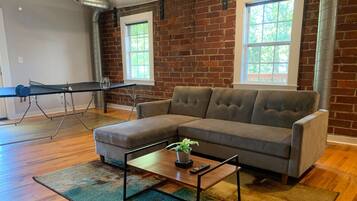 Krog Street Industrial loft | Living room | 50-inch flat-screen TV with digital channels, TV, streaming services