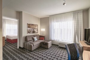 Suite, 1 Bedroom, City View | Living area | 55-inch flat-screen TV with cable channels, TV