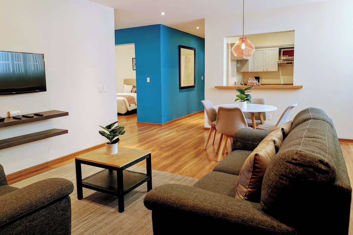 Apt 2, 2 bedrooms, 3 beds, 1 bath | Living area | 54-inch Smart TV with cable channels, TV, Netflix