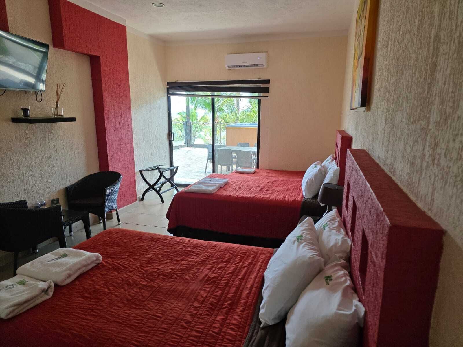 Habitación cuádruple Deluxe | Cortinas opacas, wifi gratis, ropa de cama