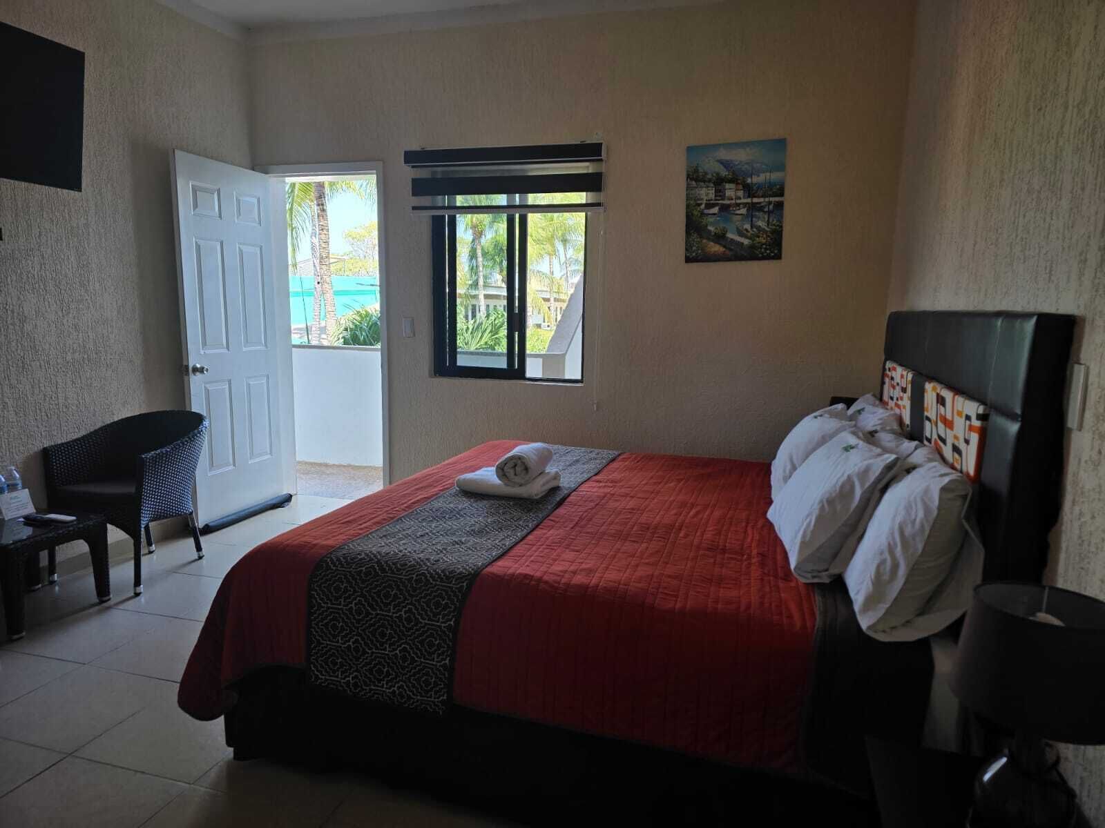 Habitación superior | Cortinas opacas, wifi gratis, ropa de cama