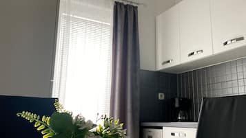 Comfort Apartment | Private kitchen | Full-sized fridge, stovetop, coffee/tea maker, toaster