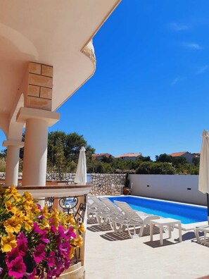 Seasonal outdoor pool, open 9:00 AM to 9:00 PM, pool umbrellas