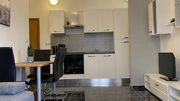 Comfort Apartment, Partial Sea View | Living area | 32-inch TV with satellite channels
