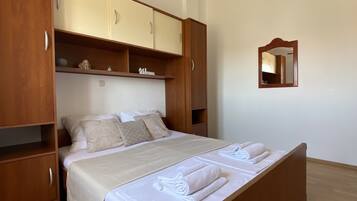 Standard Apartment, Partial Sea View | 1 bedroom, individually furnished, desk, blackout curtains