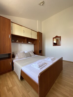 Standard Apartment, Partial Sea View | 1 bedroom, individually furnished, desk, blackout curtains