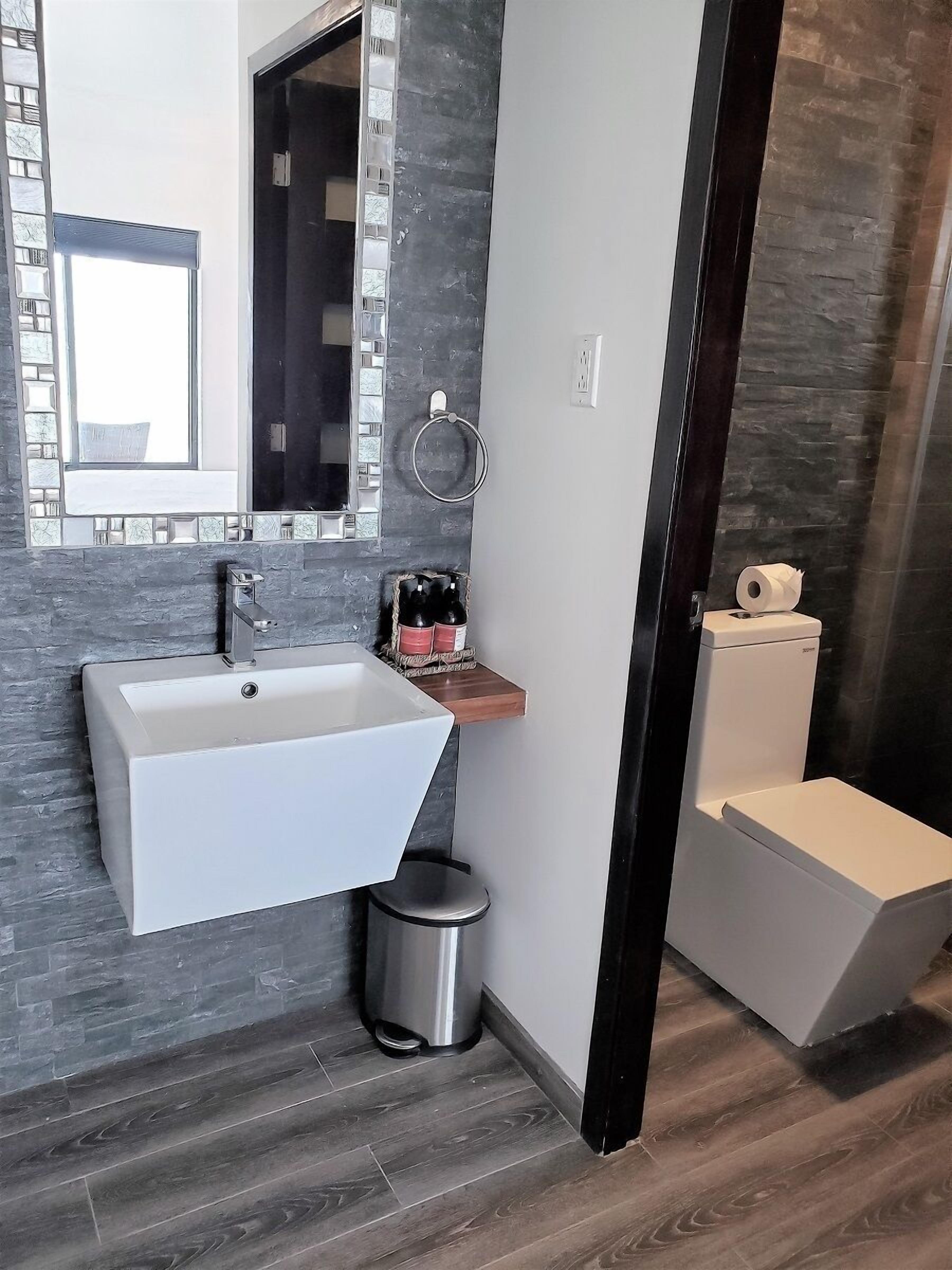 deluxe suite, 2 double beds, pool access, ocean view (sea front) | bathroom | shower, towels, soap, shampoo