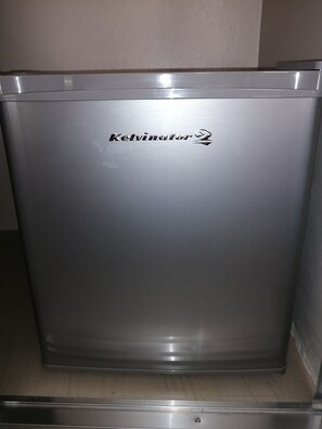 A stainless steel refrigerator with the brand name "Kelvinator" visible on the front. - Harman Suites Moalboal (Moalboal)
