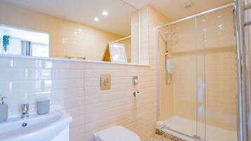 Shower, hair dryer, towels, soap