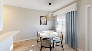 Enjoy meals in this cozy dining area with a round table and four chairs.