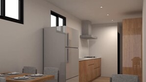 Una cocina moderna con refrigerador integrado, armarios de madera y estufa a gas.