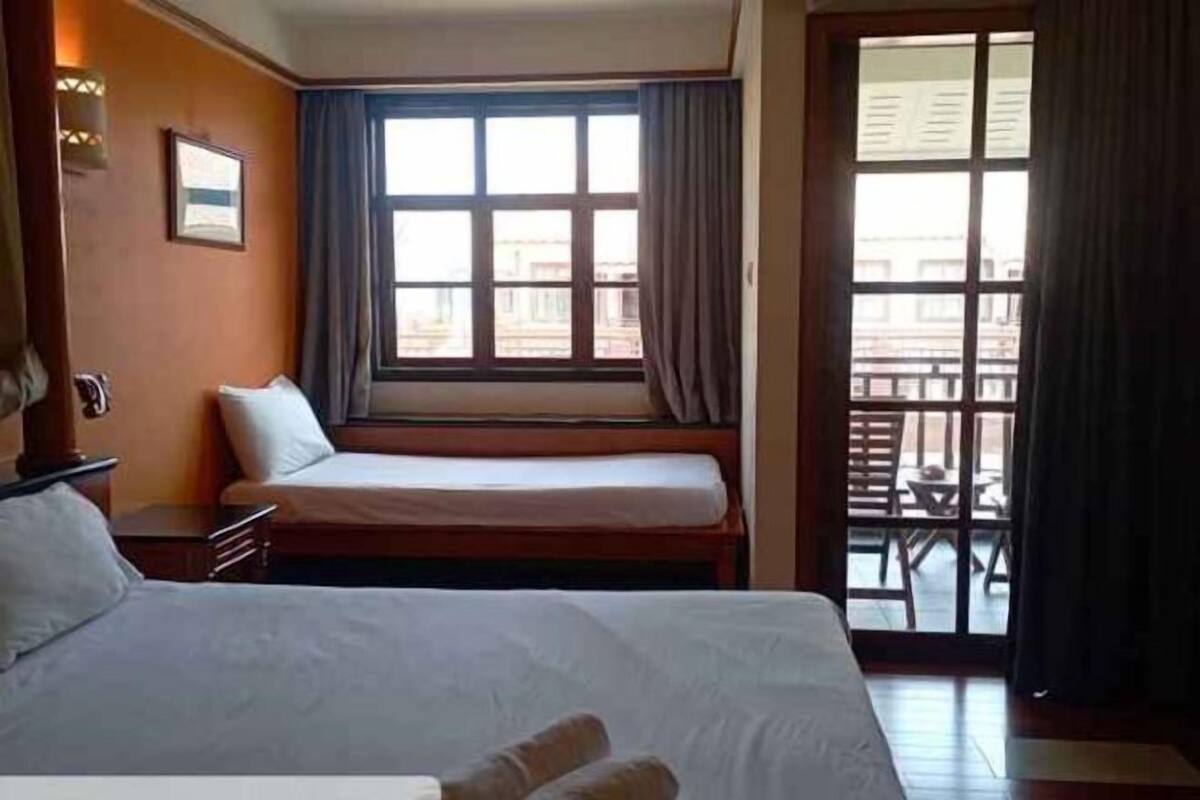 Desk, iron/ironing board, bed sheets