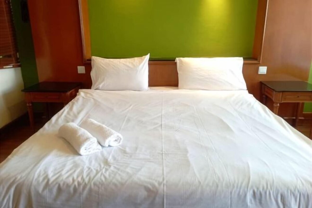 Desk, iron/ironing board, bed sheets