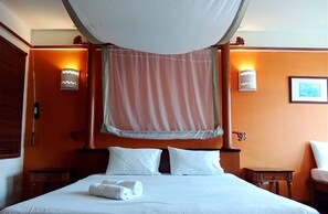 Executive Chalet, Partial Sea View | Desk, iron/ironing board, bed sheets