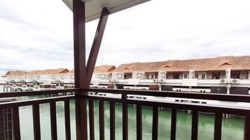 A series of overwater bungalows with a view of the ocean.