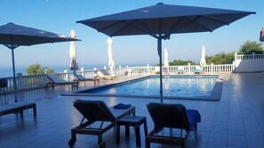Seasonal outdoor pool, open 7:30 AM to 11:30 PM, pool loungers