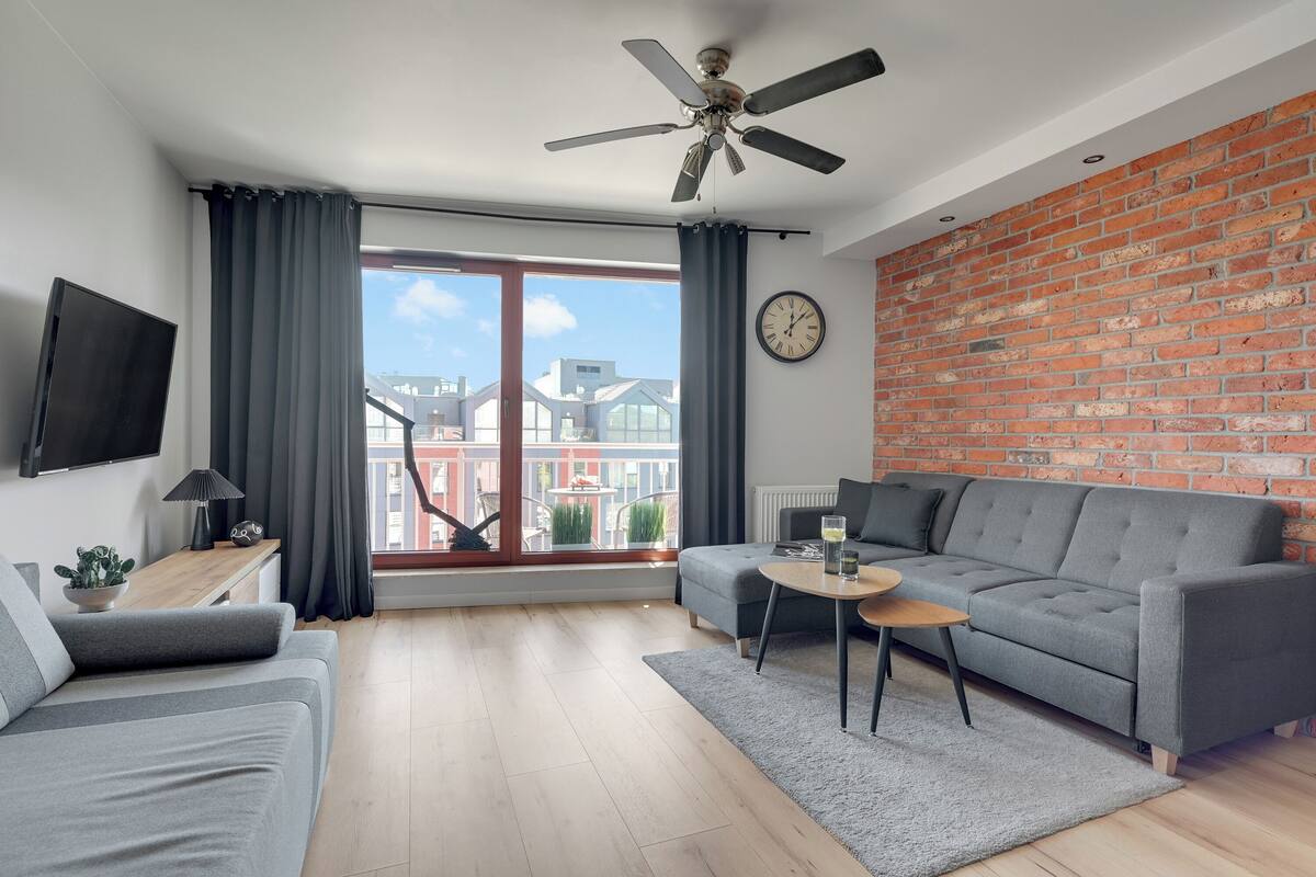 Superior Apartment, 1 Bedroom, Balcony, City View | Living area | 50-inch TV with cable channels