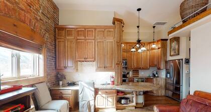 Stylish, downtown condo w/ loft, kitchen, & fireplace plus shared patio & grill