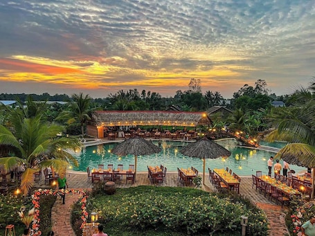 Outdoor pool, open 8:00 AM to 7:00 PM, pool umbrellas, pool loungers. Can Tho Ecolodge