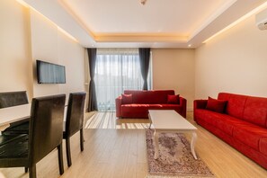 Apartment, 1 Bedroom | Living room | TV - Tema Lara Apart (Antalya)