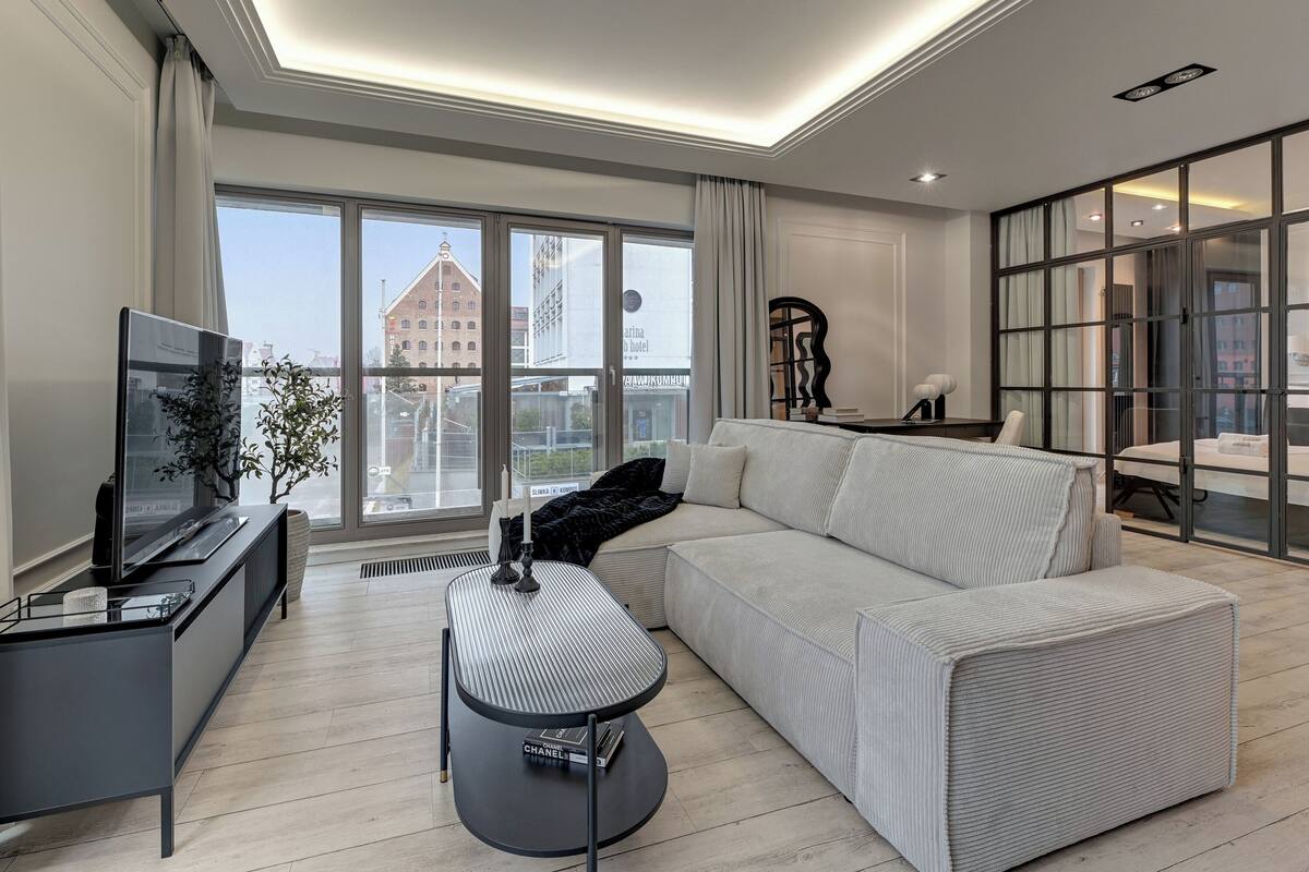 Exclusive Apartment | Living area | 50-inch flat-screen TV with satellite channels