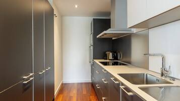 Deluxe Apartment, 1 Bedroom | Private kitchen | Full-sized fridge, microwave, oven, stovetop