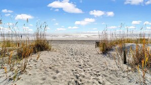A sandy beach with sparse vegetation and a clear sky. - #121 BREAKERS, HILTON HEAD ISLAND, SC (Hilton Head Island)