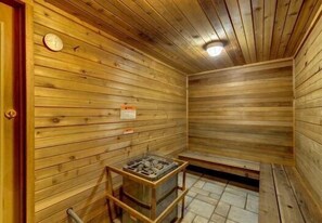 A wooden sauna room with a bench, a small table, and a clock on the wall. - Giant Steps 17 - 2 bdrm 2 bath ski in/out in building one - Next to the slopes (Brian Head)