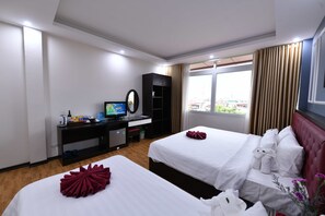 Deluxe Triple Room, City View | Minibar, in-room safe, desk, blackout drapes