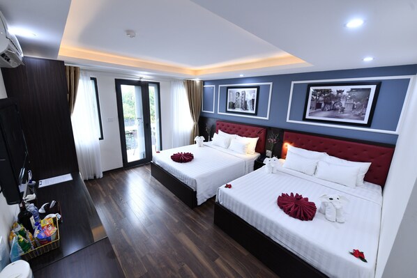 Family Suite, 2 Queen Beds, Balcony, City View | Minibar, in-room safe, desk, blackout drapes