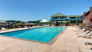 A swimming pool with lounge chairs and a covered area. - Fall is a great time for a relaxing getaway at Birds Eye View, Bernard's Landing (Moneta)