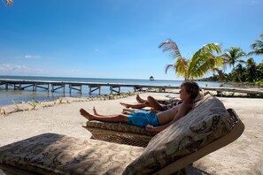 On the beach, sun loungers, beach towels