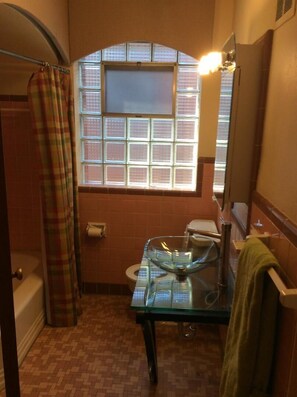 Bathtub, hair dryer, towels, soap