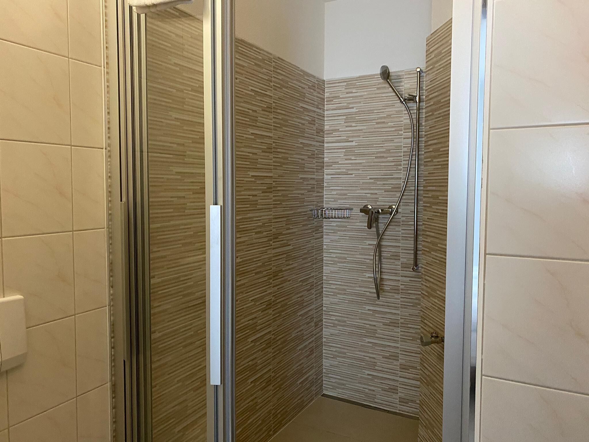 shower, free toiletries, hair dryer, slippers