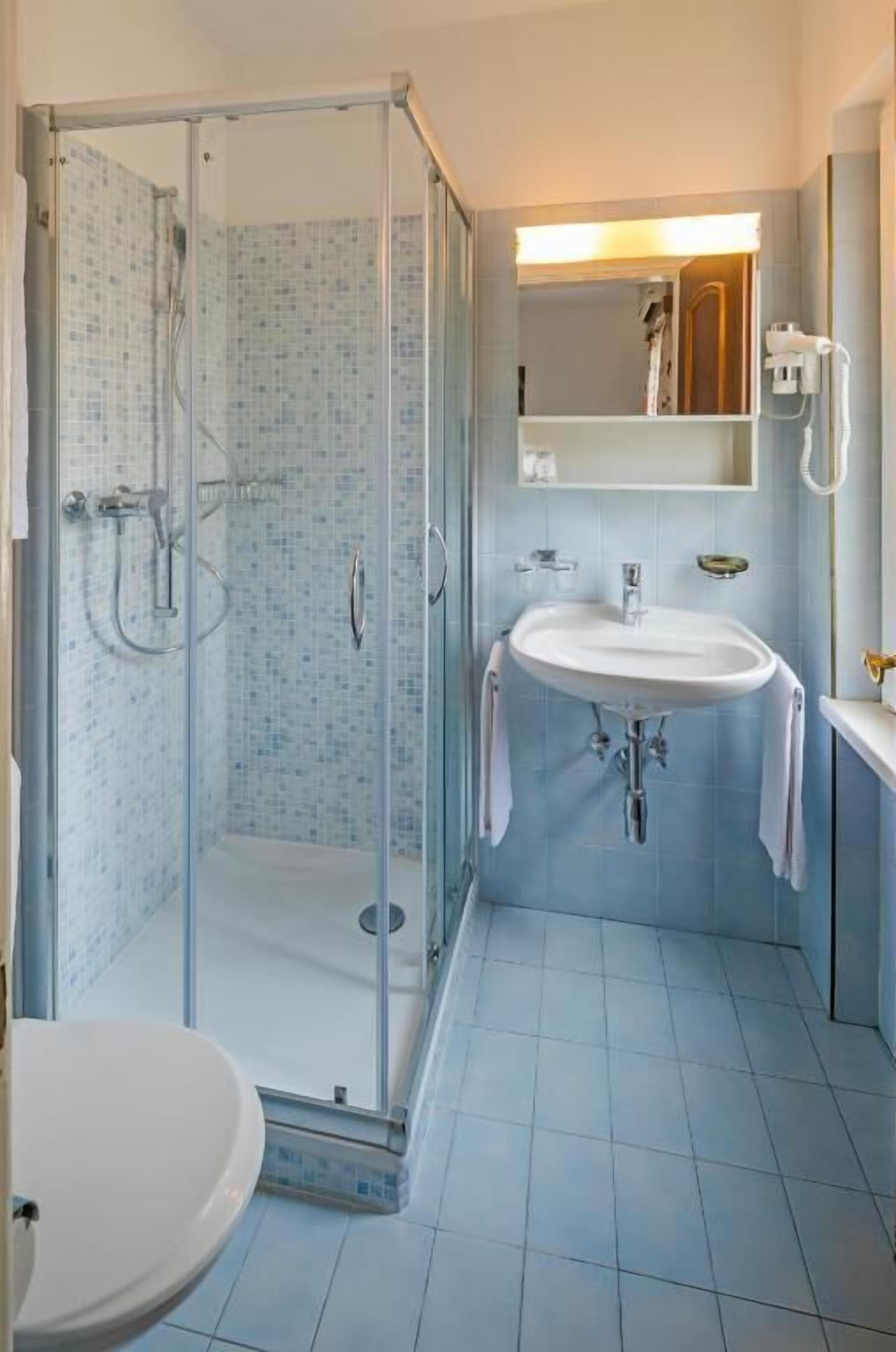 shower, free toiletries, hair dryer, slippers