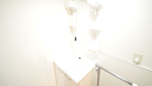 A bright, white interior space with a counter and a mirror. - GATE80 nagai stadium (Osaka)