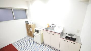 Fridge, microwave, electric kettle, cookware/dishes/utensils