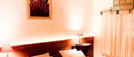 Minibar, desk, blackout curtains, iron/ironing board