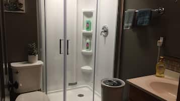 Shower, hair dryer, towels, shampoo
