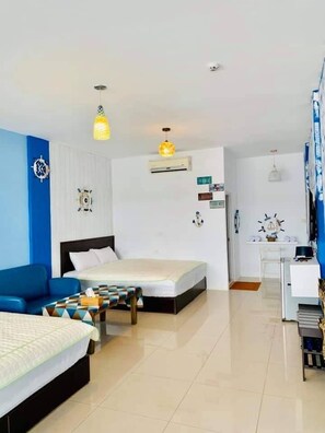 Deluxe Quadruple Room | Desk, blackout drapes, free WiFi, bed sheets