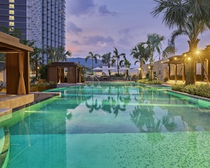 Outdoor pool, open 7:00 AM to 10:00 PM, pool umbrellas, sun loungers