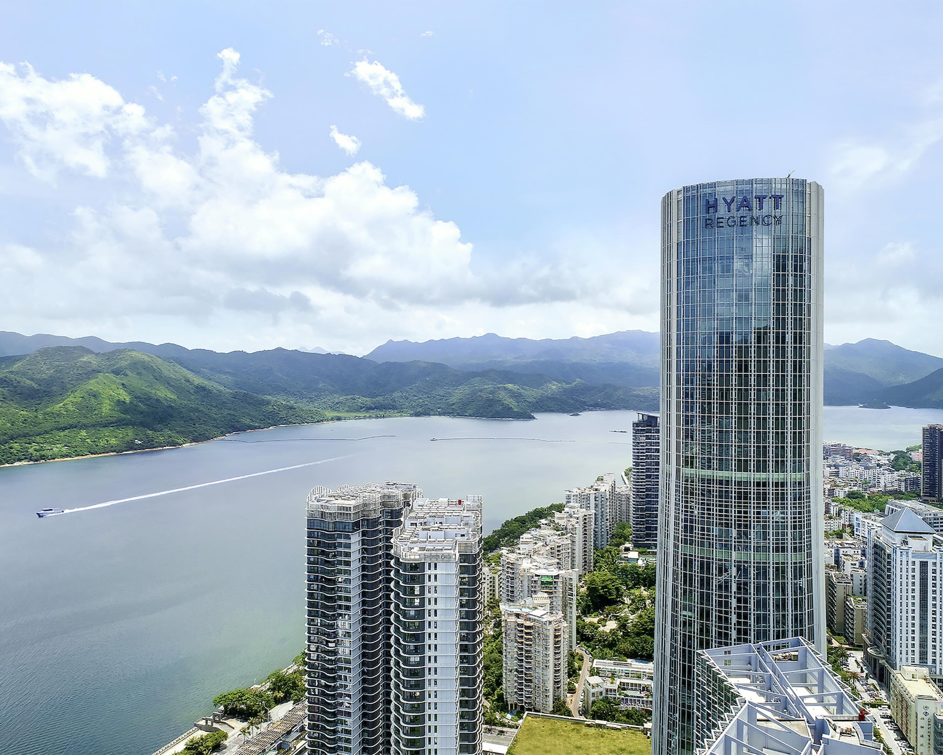 A high-rise building with the name "HYATT REGENCY" prominently displayed.