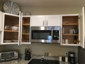 Fridge, microwave, stovetop, coffee/tea maker