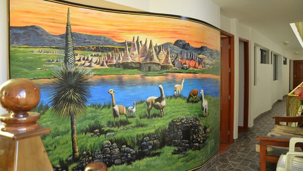 A hallway with a large mural depicting a landscape with mountains, a lake, and various animals. - Hotel El Eden de Adan y Eva (Andahuaylas)