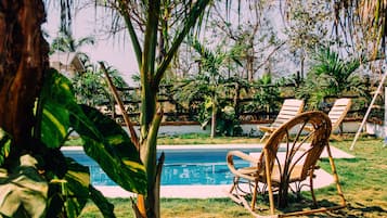 Outdoor pool, open 8:00 AM to 10:00 PM, pool umbrellas, pool loungers