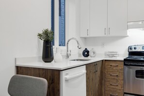Deluxe Apartment, 1 Bedroom, Patio, City View (Mont-Royal 302) | Private kitchen | Full-sized fridge, microwave, oven, stovetop - Liv MTL - MTL (Montreal)