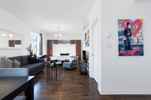 Deluxe Studio, 1 Queen Bed with Sofa bed, Patio, City View (Mont-Royal 301) | Living area | 49-inch flat-screen TV with digital channels, Smart TV, offices - Liv MTL - MTL (Montreal)
