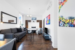 Deluxe Studio, 1 Queen Bed with Sofa bed, Patio, City View (Mont-Royal 201) | Living area | 49-inch flat-screen TV with digital channels, Smart TV, offices - Liv MTL - MTL (Montreal)