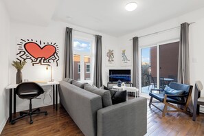 Deluxe Apartment, 1 Bedroom, Patio, City View (Mont-Royal 302) | Living area | 49-inch flat-screen TV with digital channels, Smart TV, offices - Liv MTL - MTL (Montreal)